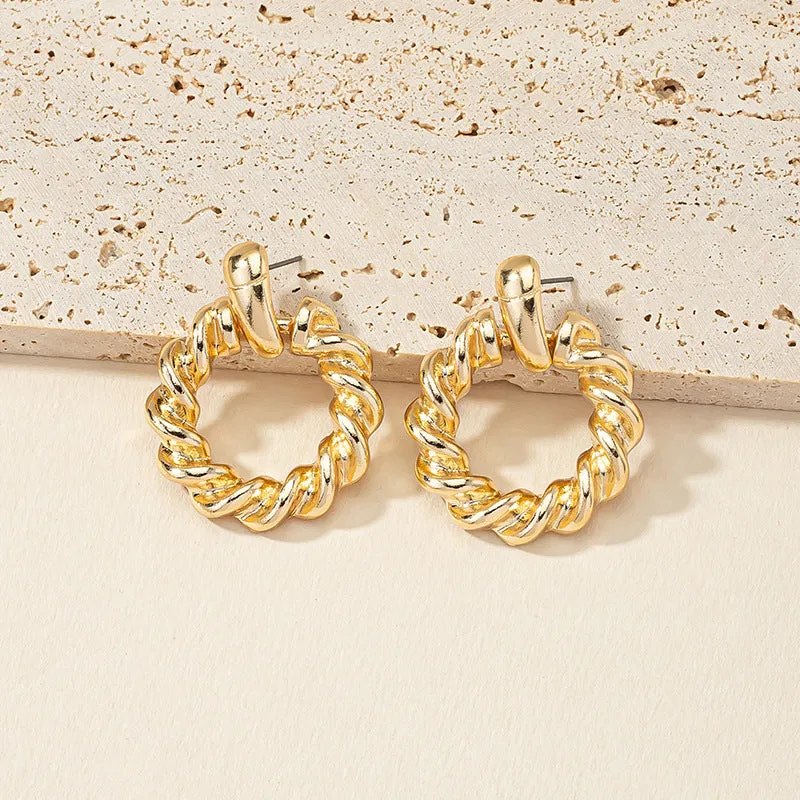 Golden Circle Twist Earrings with Stylish Woven Design