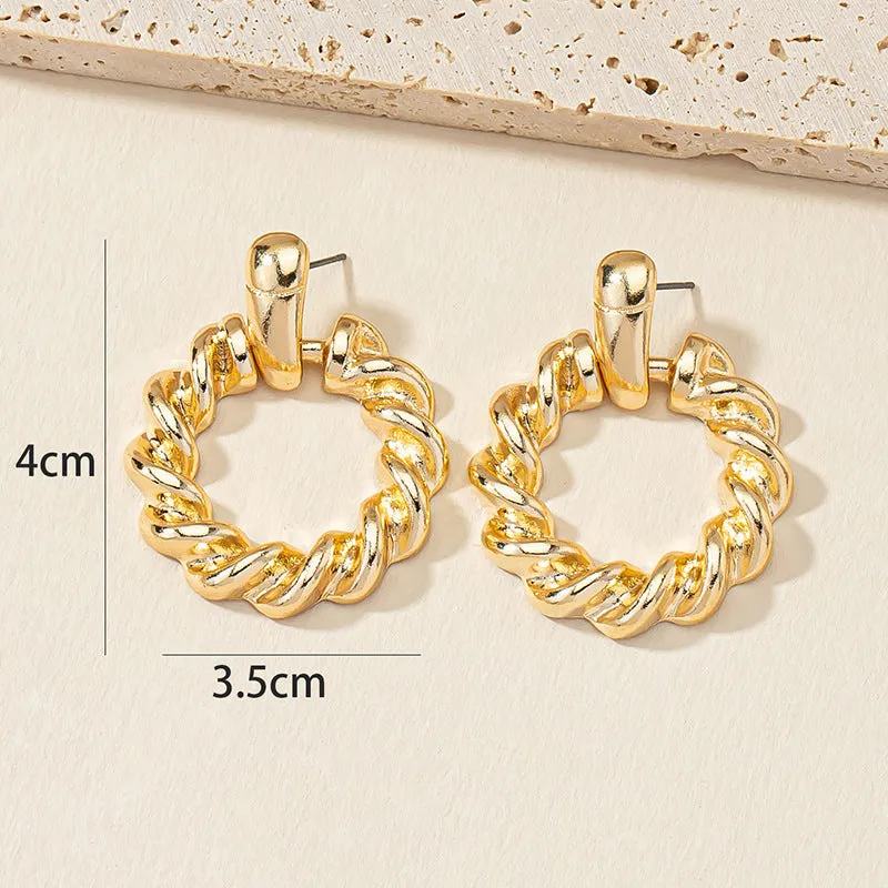 Golden Circle Twist Earrings with Stylish Woven Design